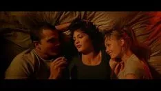 Play Three strangers share the same bed